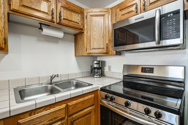Kitchen sink with stainless range and microwave