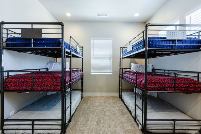 Bunk room with two triple-tier twin bunk beds at Las Palmas 704