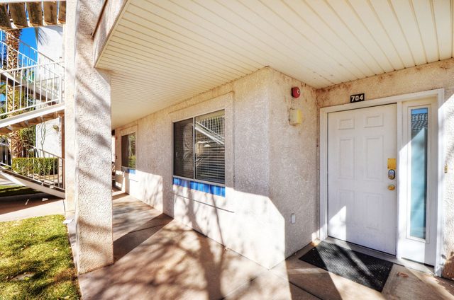 Covered front entry door of Las Palmas 704 condo