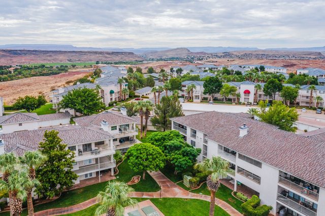 Aerial of Las Palmas resort condo buildings with red rock backdrop