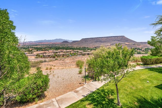 Desert wash and flat-topped mesa seen from the resort lawn