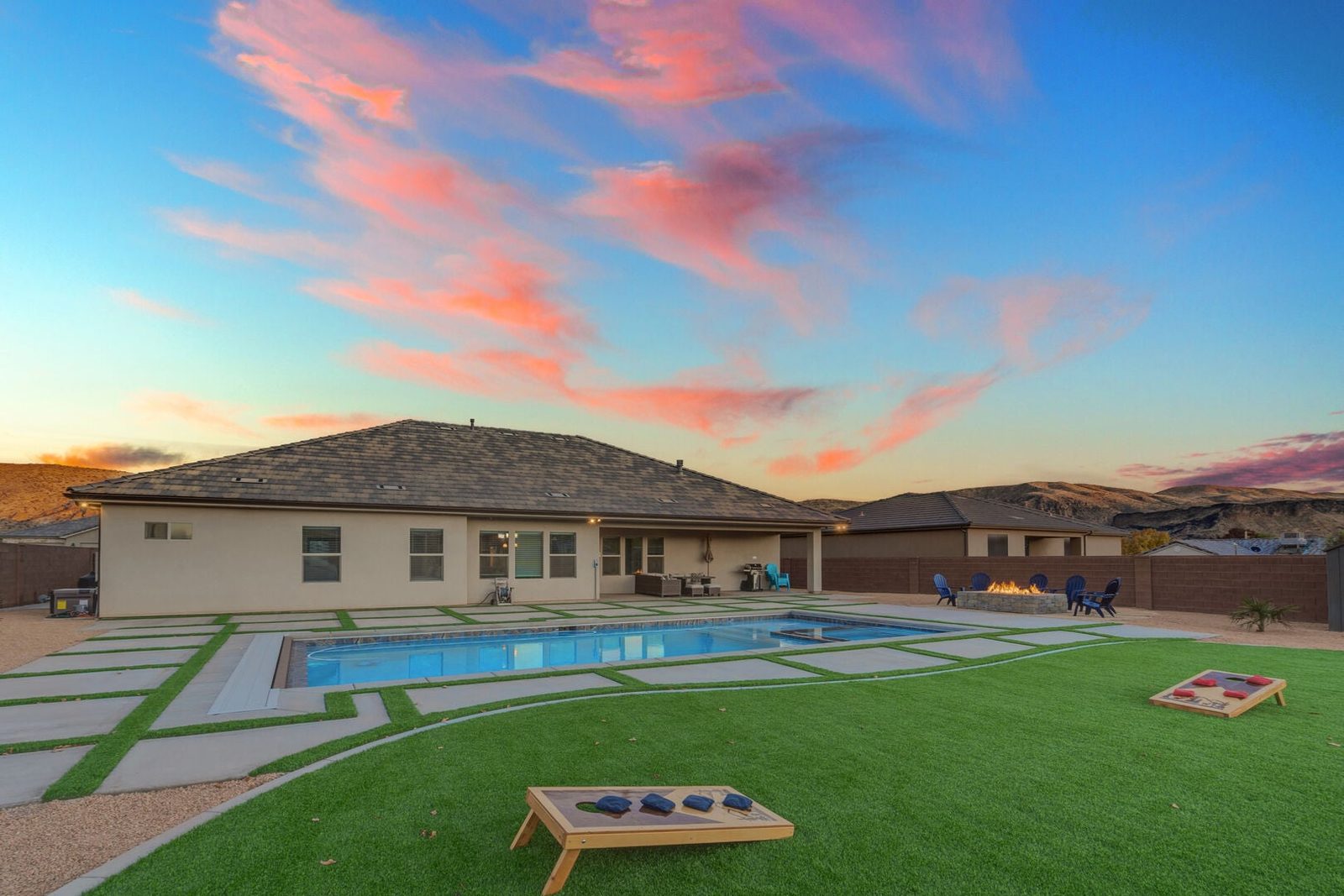 LaVerkin 112~Poolside Paradise backyard with private pool and lawn at sunset