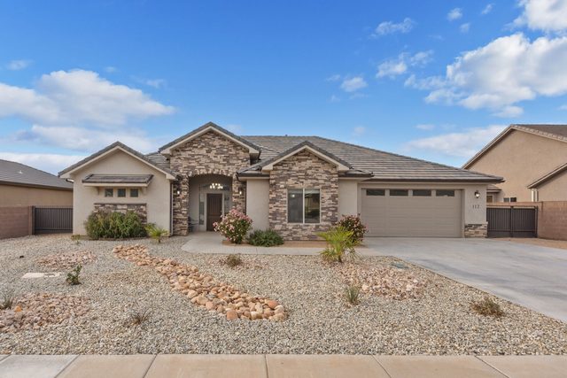 Front of LaVerkin 112~Poolside Paradise single-level home with stone accents