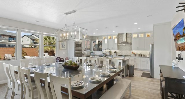 Home 107 long dining table beside the open kitchen
