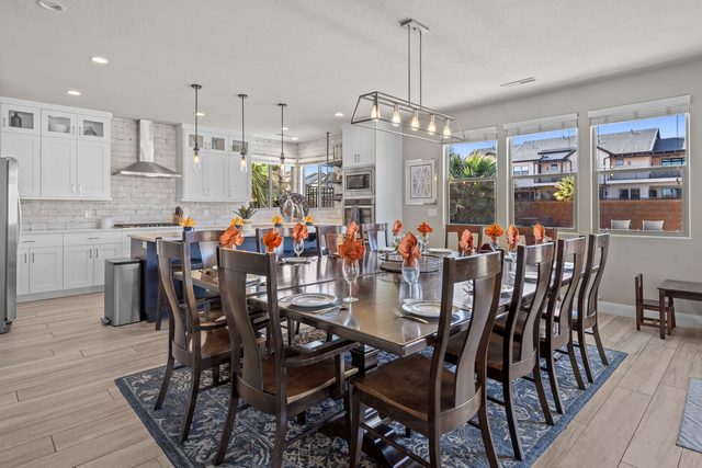 Home 108 dining table for twelve by large windows