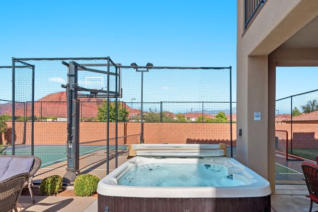 Home 108 private hot tub next to the fenced sports court