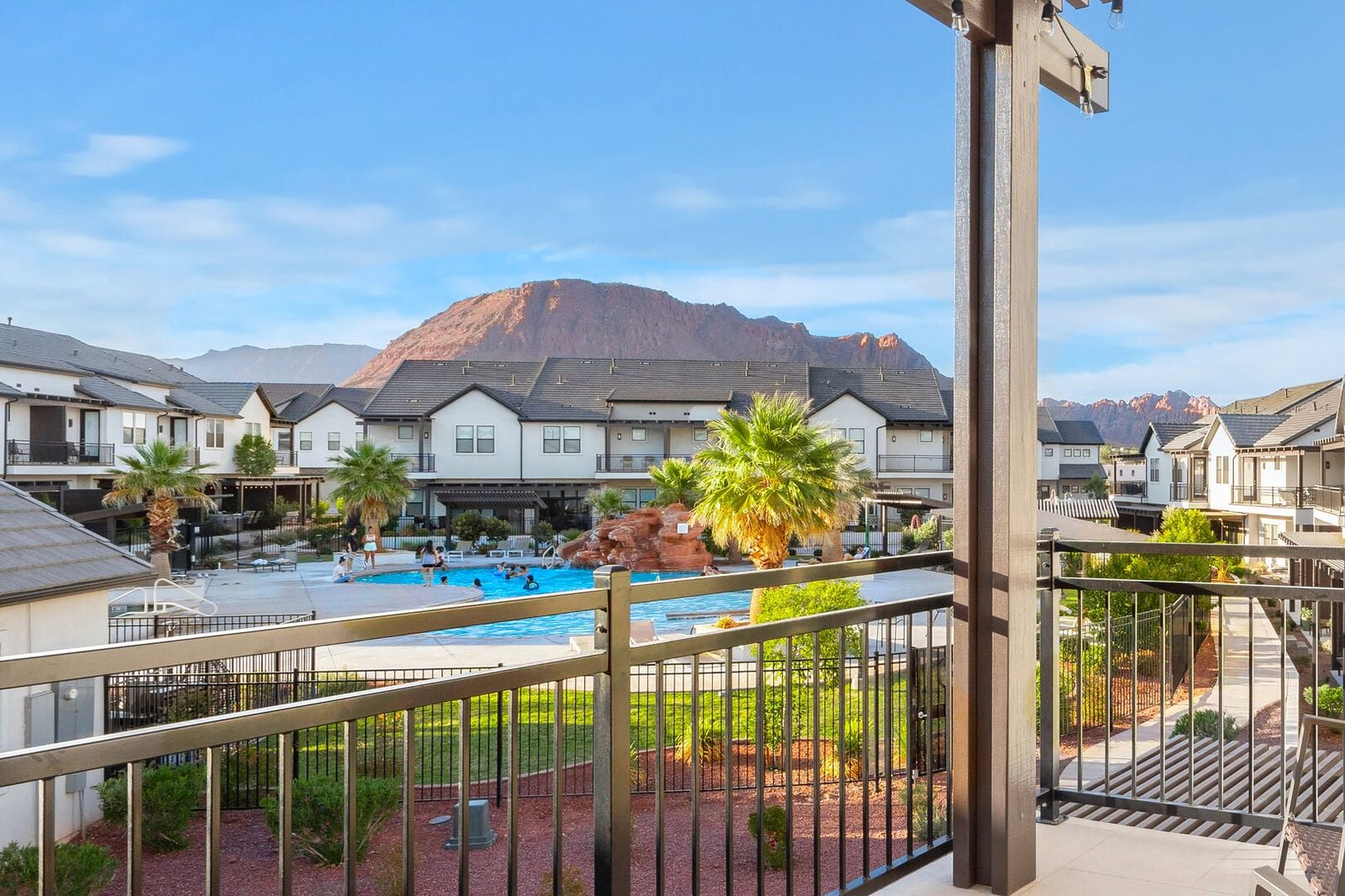 Balcony view of resort pool and red mountain from Ocotillo Springs 16
