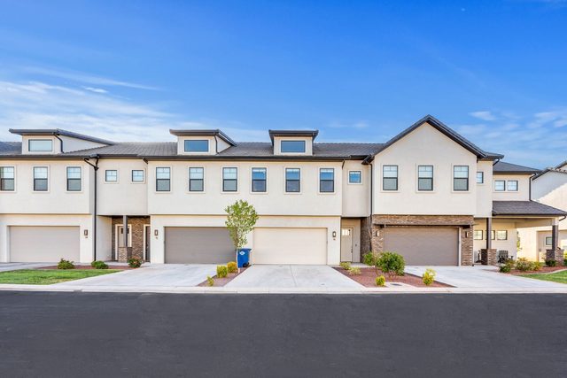 Street view of Ocotillo Springs 16 townhome row with garages
