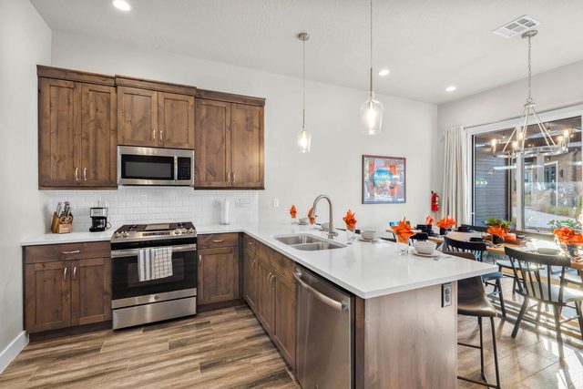 Kitchen with gas range, dishwasher and dining nook