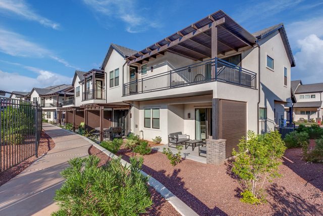 Rear exterior of Pools Edge with upper balcony and pergola