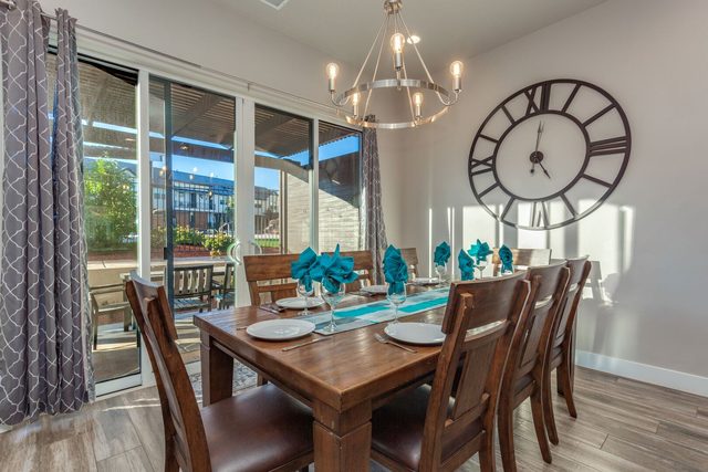 Dining area with chandelier and sliding door to patio