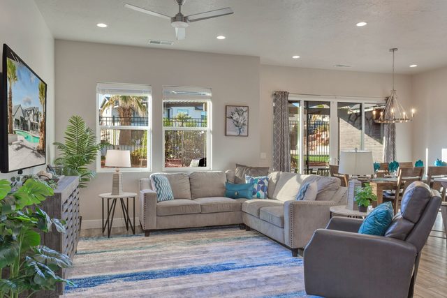Main-level living room with sectional sofa and recliner