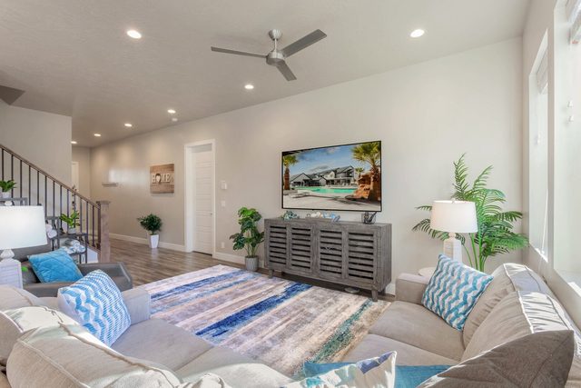 Living room sectional facing a large wall TV