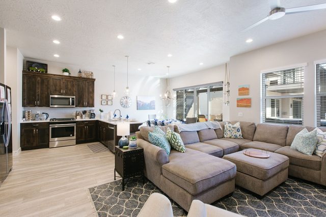Living room sectional open to the kitchen and dining area