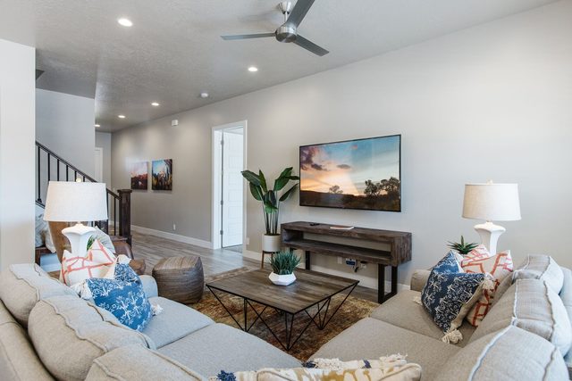 Living room sectional, coffee table and wall-mounted TV