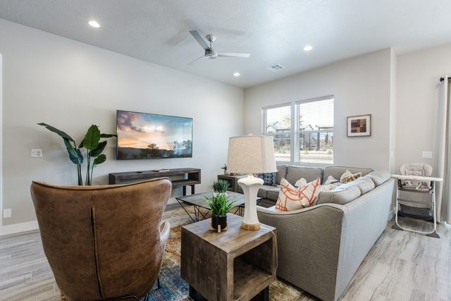 Great room with leather chair, sectional sofa and TV