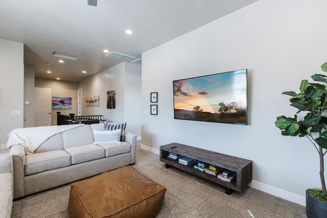 Loft sofa and TV with foosball table in the hall