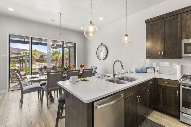 Kitchen island opening to the dining table and patio doors