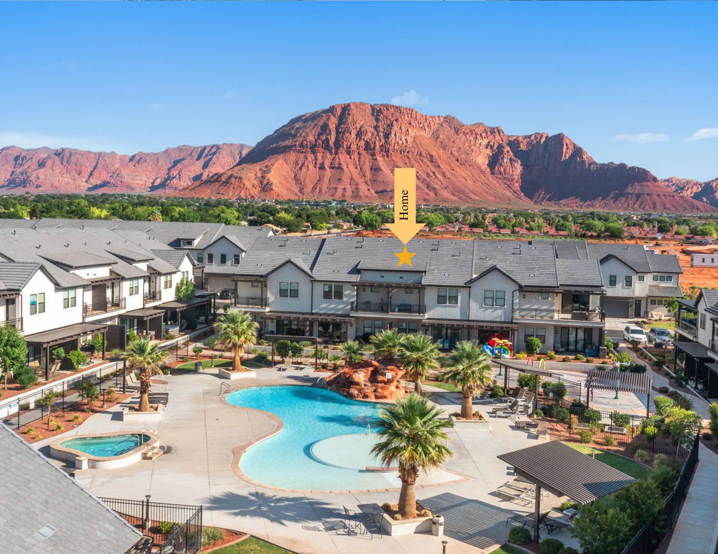 Aerial of Ocotillo Springs 26 townhomes, resort pool and red cliffs