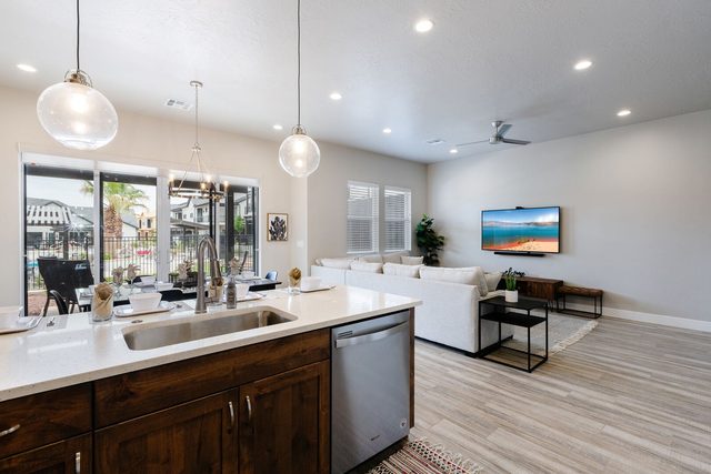 Kitchen island with sink and dishwasher at Ocotillo Springs 27