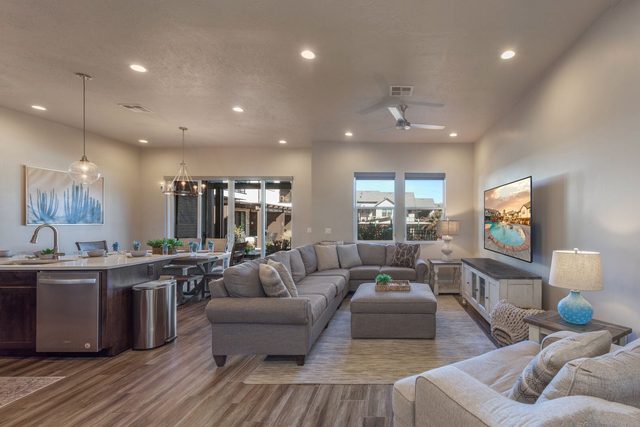 Open great room joining kitchen, dining and sectional living area