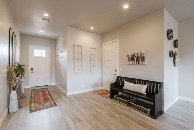 Entry hall with bench and front door at Ocotillo Springs 32