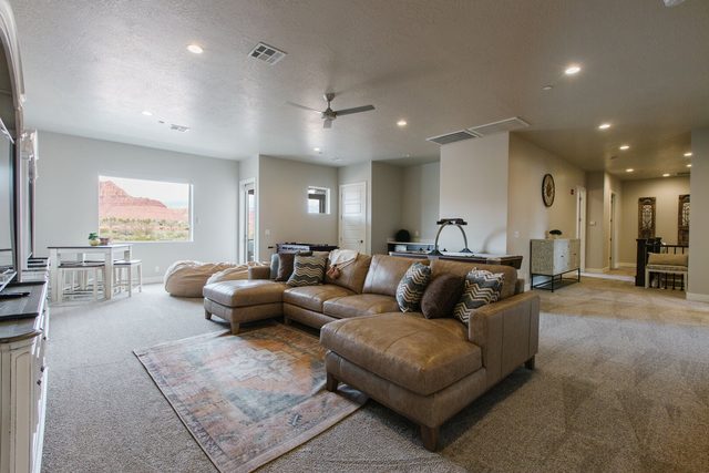Upstairs loft lounge with sectional and card table at Ocotillo Springs 32