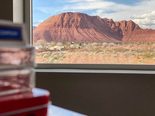 Red rock mountain view through a loft window at Ocotillo Springs 32