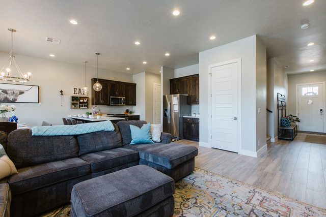 Great room sectional looking toward the kitchen and entry
