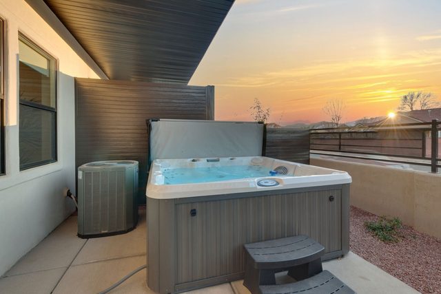 Private hot tub on the back patio at sunset