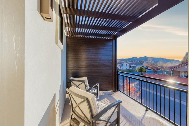 Master balcony seating with mountain view at sunset
