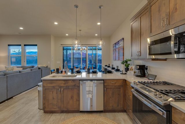 Kitchen sink peninsula with gas range and microwave