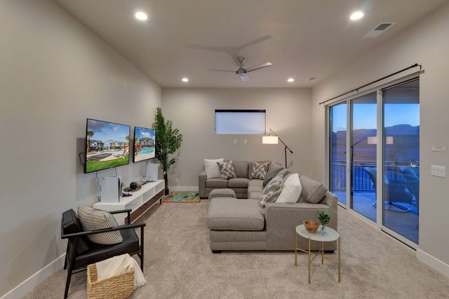 Upstairs loft lounge with sectional and TVs at Ocotillo Springs 42