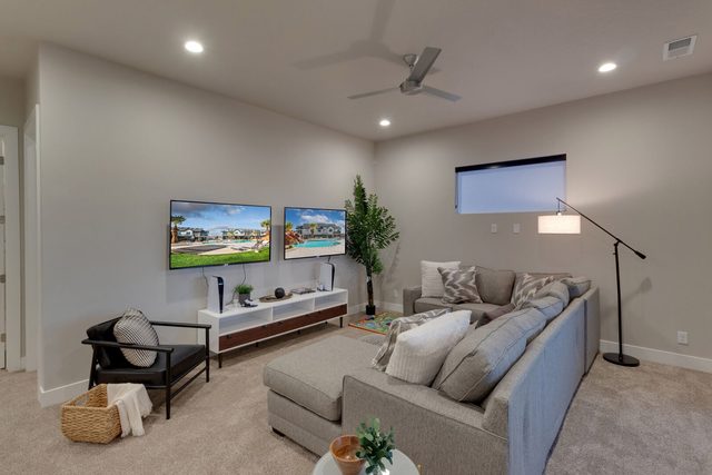 Loft sectional sofa with two wall TVs and chair