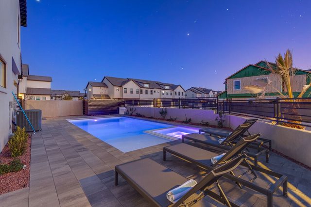 Private pool and spa with loungers at dusk at Ocotillo Springs 42