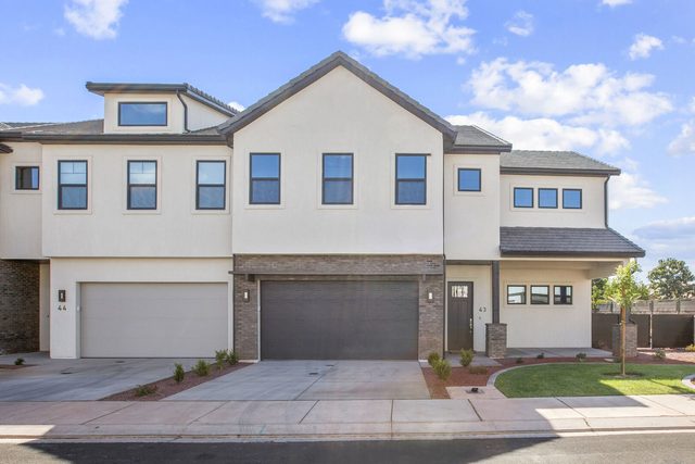 Front exterior of Ocotillo Springs 43 townhome with garage