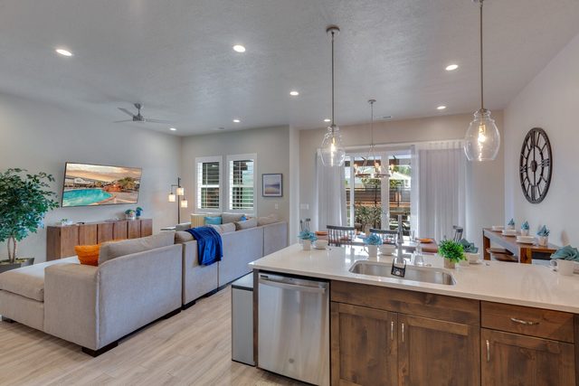 Kitchen island with sink open to the living room at Ocotillo Springs 44~Sky Fire