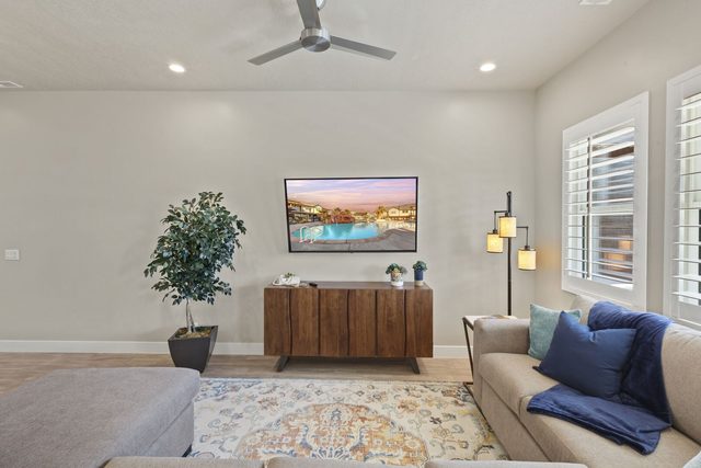 Living room with sectional sofa and wall-mounted TV at Ocotillo Springs 44~Sky Fire