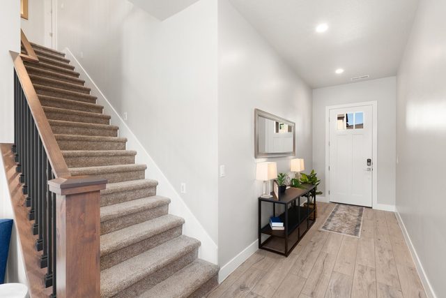 Entry hallway with staircase and console table