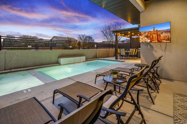 Private pool and covered patio with outdoor TV at Southern Comfort
