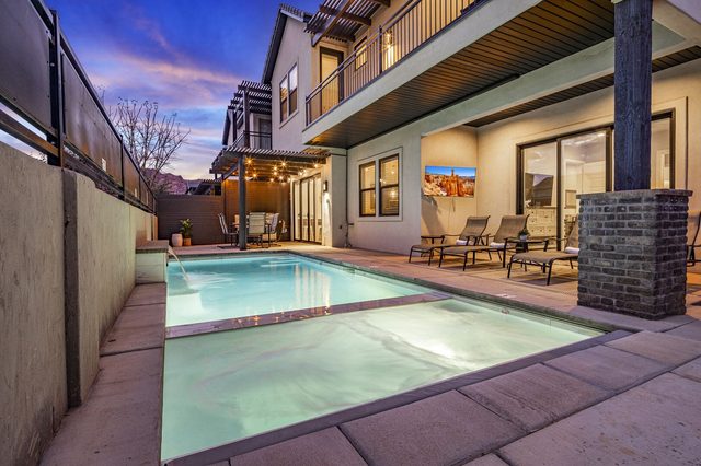 Private pool and raised spa beside the covered patio