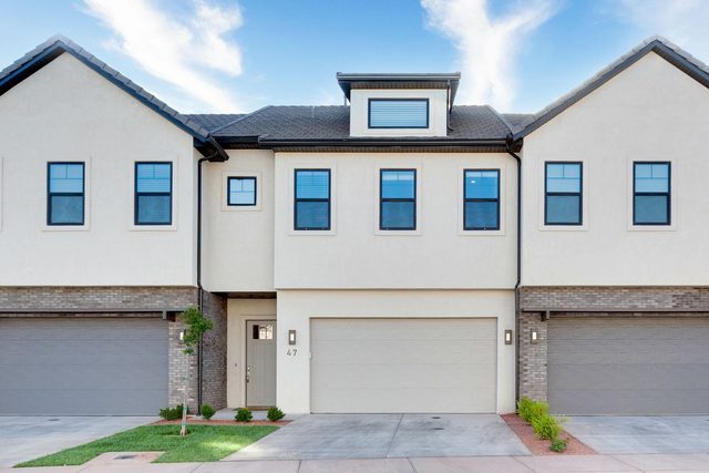 Front of Ocotillo Springs 47~Springs two-story townhome with garage