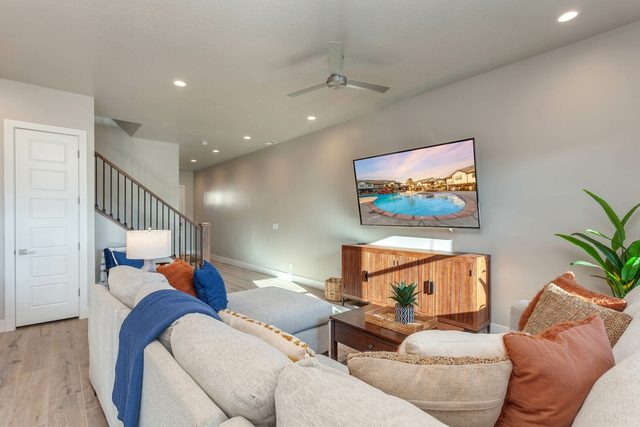 Sectional sofa facing the TV with stairs to the loft