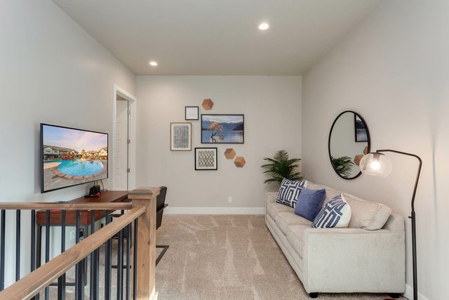 Upstairs loft with sofa, smart TV and desk