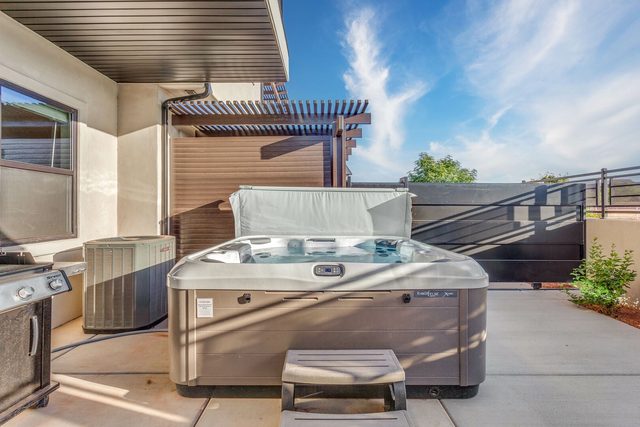 Private hot tub on the fenced back patio