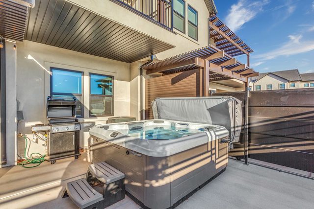 Private hot tub beside the BBQ grill on the patio