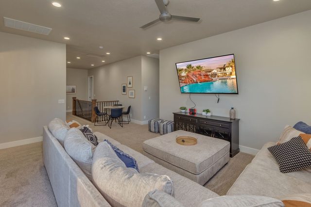 Loft sectional and TV overlooking the stair landing