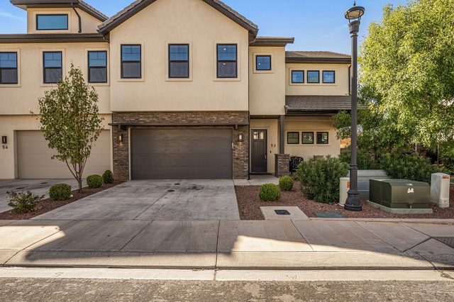 Front of Ocotillo Springs 53 with two-car garage and driveway