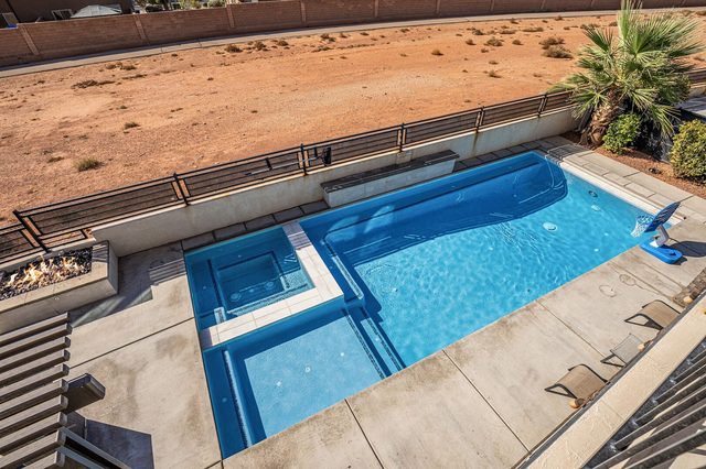 Overhead view of private pool with built-in hot tub