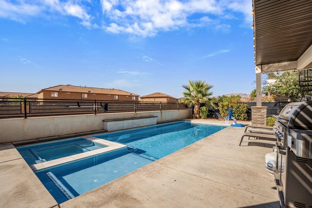 Private pool and hot tub with gas grill on the deck